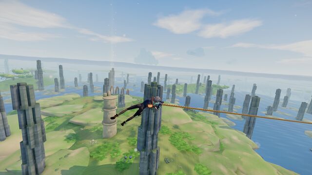 Swinging on a rope over stone pillars that rise from green islands and water
