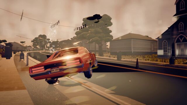 An orange muscle car gets air over a rise in a small town at dusk (full size, 1920 × 1080)