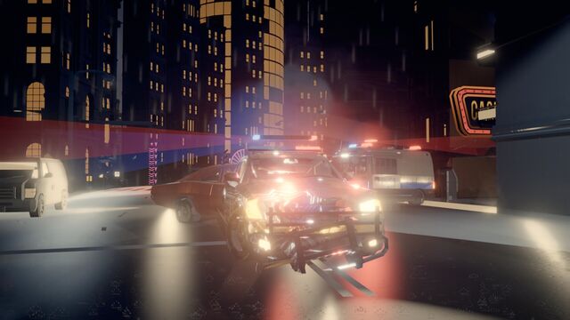 A police cruiser spins out in a pile-up on a city street at night (full size, 1920 × 1080)